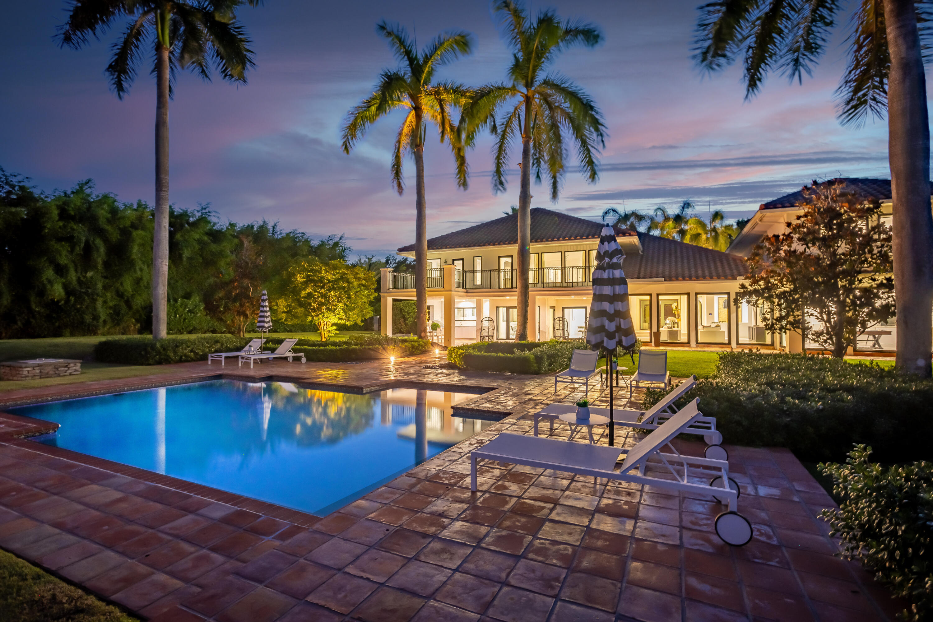 18743 Long Lake Drive Boca Raton, FL 33496 - Photo 62 of 84 a view of a swimming pool with a table and chairs