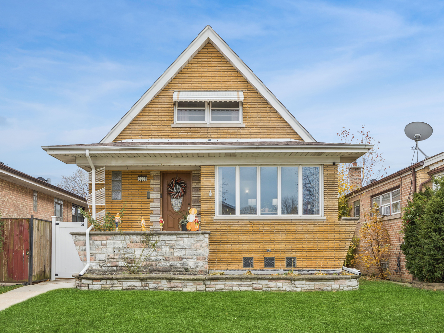 front view of a house with a yard
