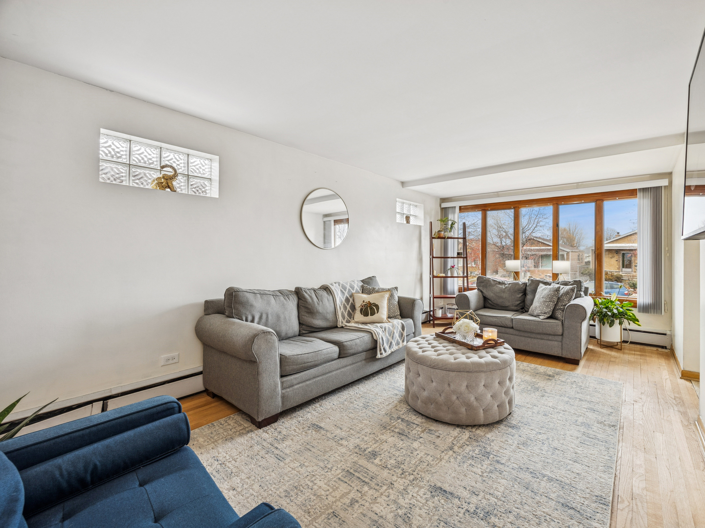 3905 West 68th Place Chicago, IL 60629 - Photo 2 of 27 a living room with furniture and a large window