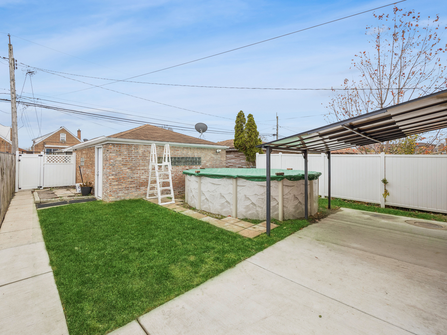 3905 West 68th Place Chicago, IL 60629 - Photo 21 of 27 a front view of a house with a yard and garage
