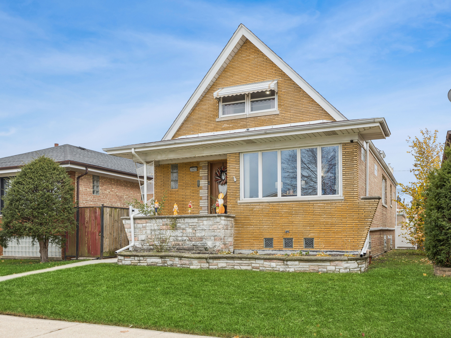 3905 West 68th Place Chicago, IL 60629 - Photo 23 of 27 a front view of a house with a yard