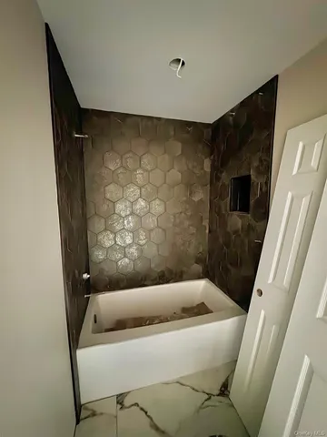 a bathroom with a bathtub