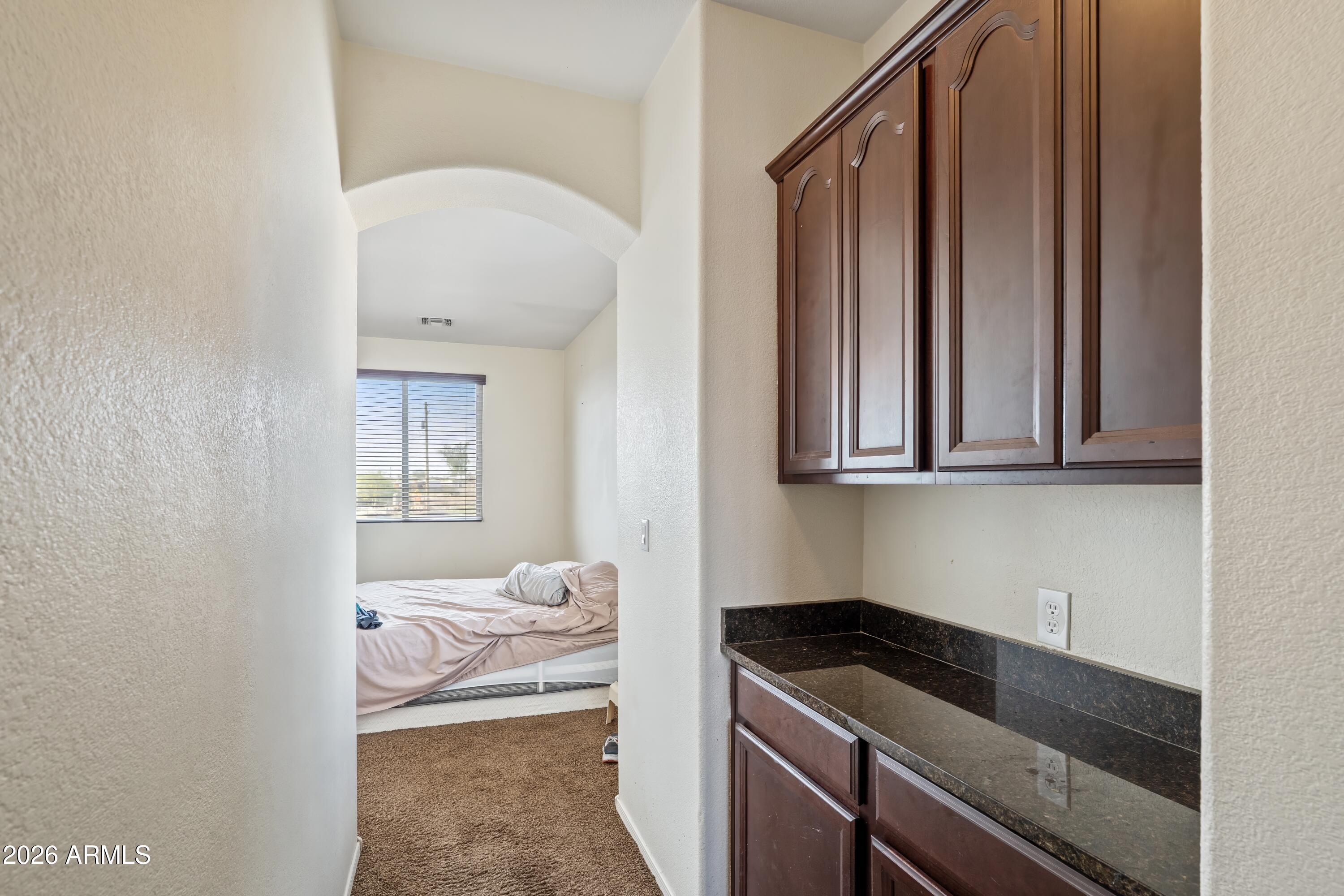 7634 West Apollo Road Laveen, AZ 85339 - Photo 18 of 34 a kitchen with a sink and cabinets