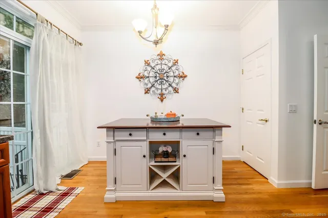 a kitchen with stainless steel appliances granite countertop a stove sink and cabinets