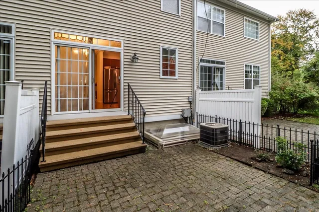 a view of a house with a bench and wooden floor