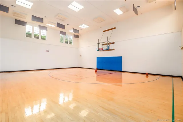 a view of a room with a refrigerator and a stove