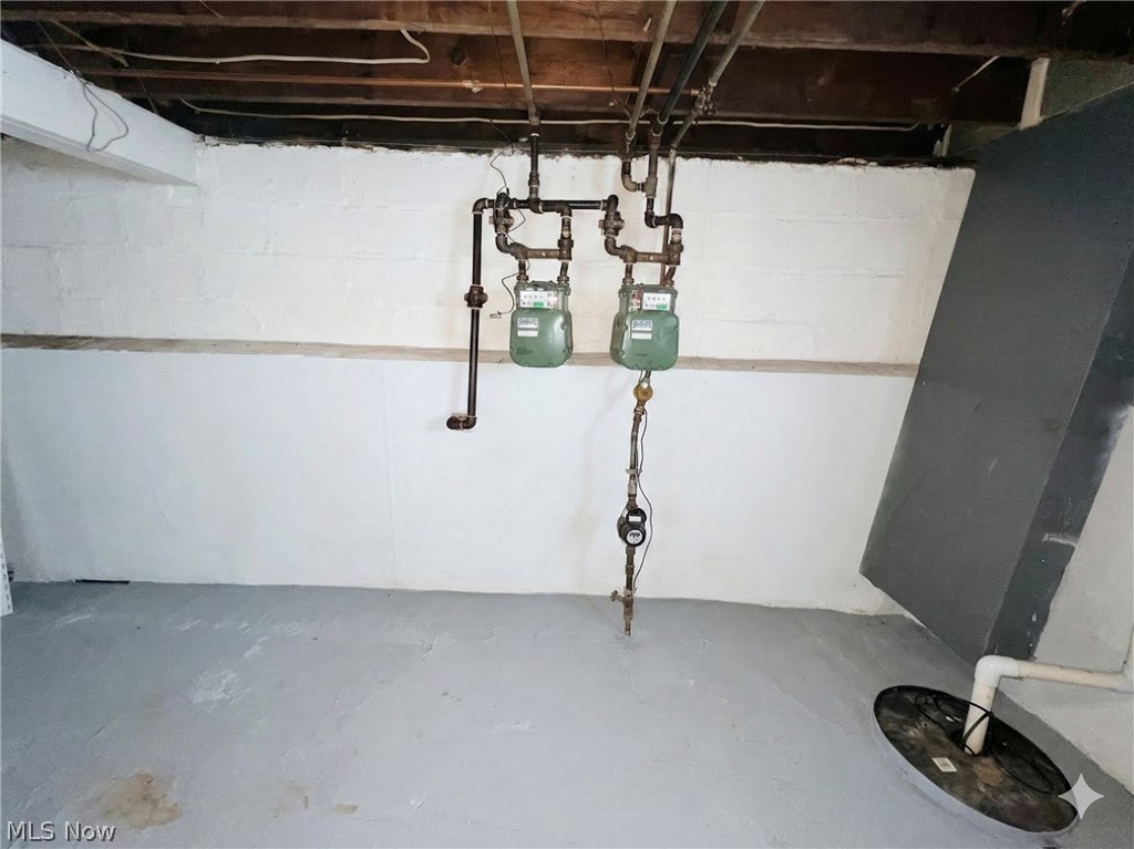 10112 Aetna Road Cleveland, OH 44105 - Photo 22 of 31 Unfinished basement featuring gas meter and drainage system