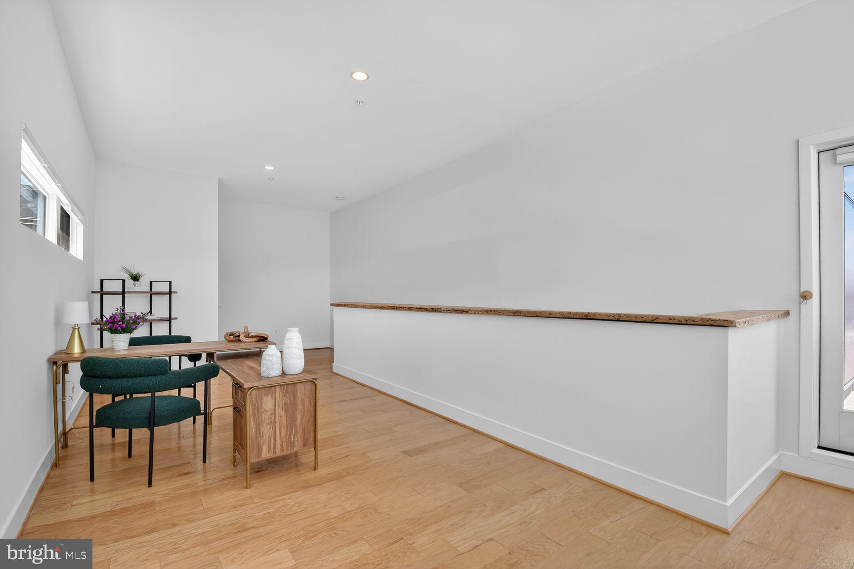 1443 Chapin Street Northwest, Unit 403 Washington, DC 20009 - Photo 17 of 24 a workspace with furniture and wooden floor