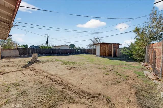 a view of a backyard of a house