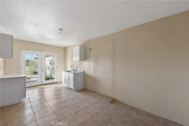 a kitchen with a sink and cabinets