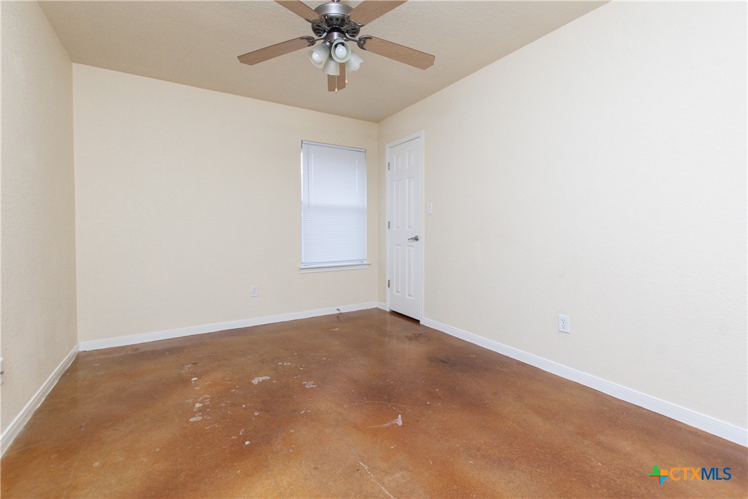 211 West Arlo Road, Unit A Harker Heights, TX 76548 - Photo 12 of 19 an empty room with a chandelier fan