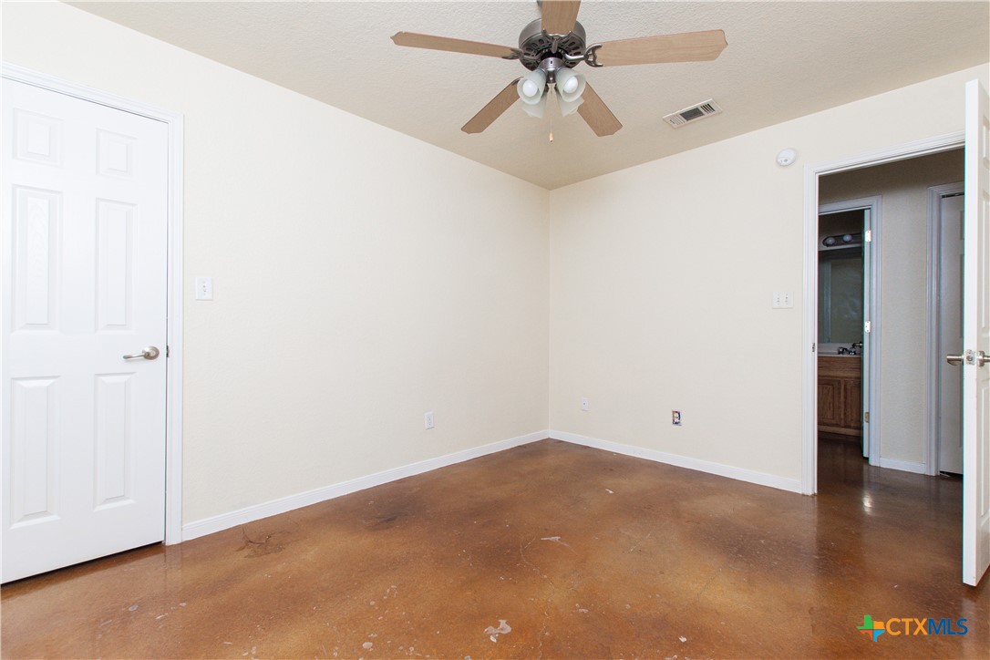211 West Arlo Road, Unit A Harker Heights, TX 76548 - Photo 13 of 19 an empty room with a ceiling fan and wooden floor