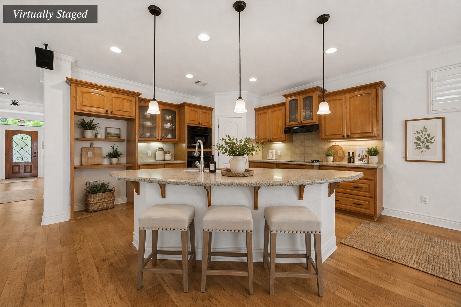 815 River Walk Trail Georgetown, TX 78633 - Photo 11 of 36 a kitchen with stainless steel appliances granite countertop a stove a refrigerator a kitchen island with a dining table and chairs