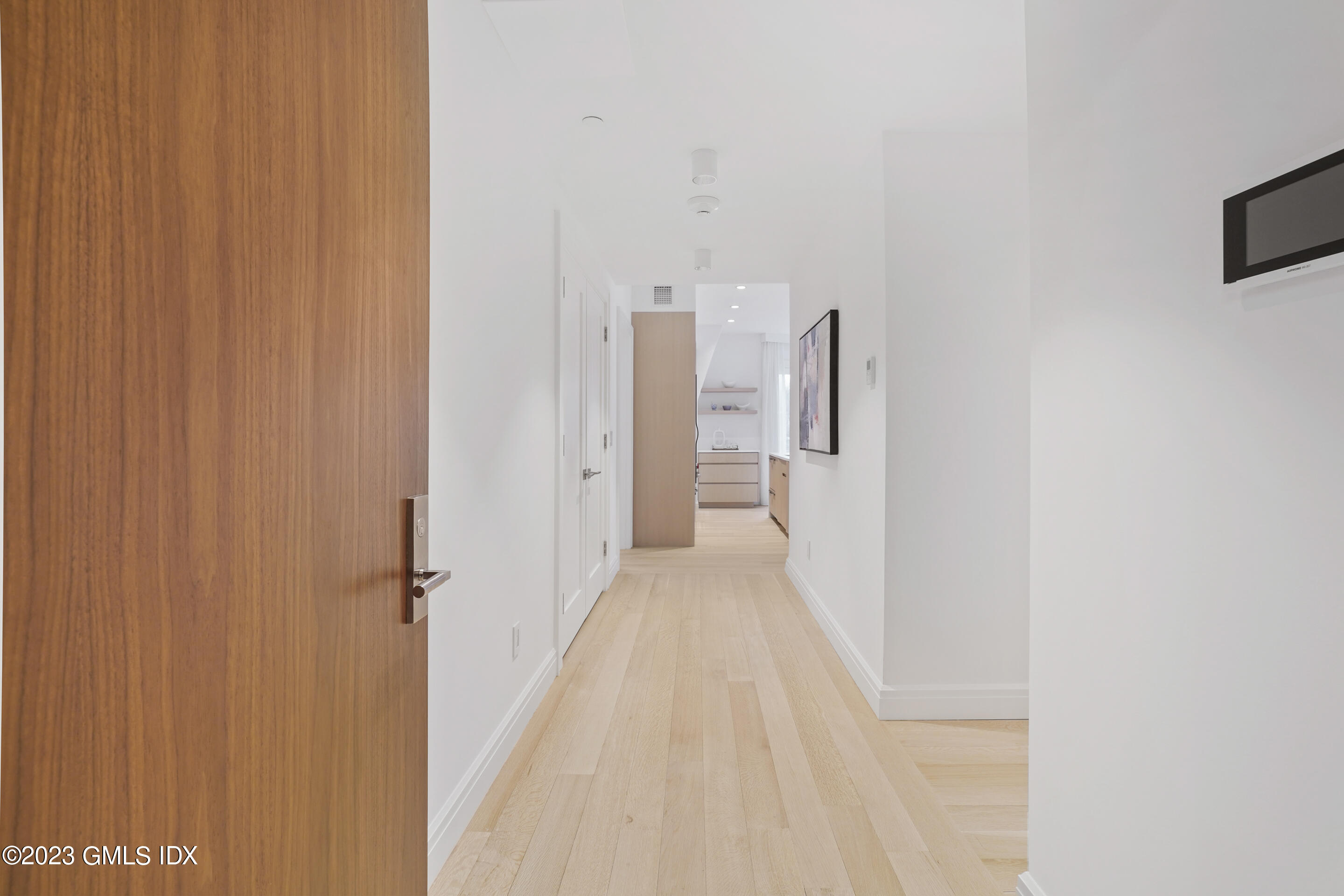89 River Road, Unit 301 Cos Cob, CT 06807 - Photo 3 of 15 a view of a room with a hallway