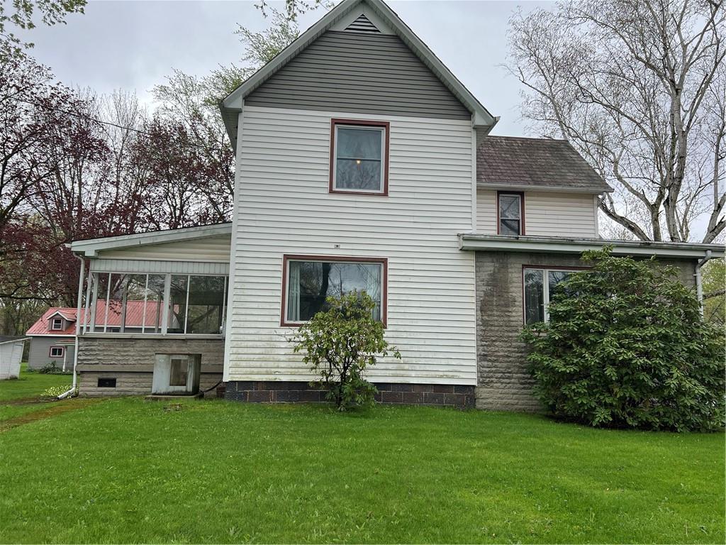 4553 Marr Road Pulaski, PA 16143 - Photo 1 of 5 a front view of a house with a garden