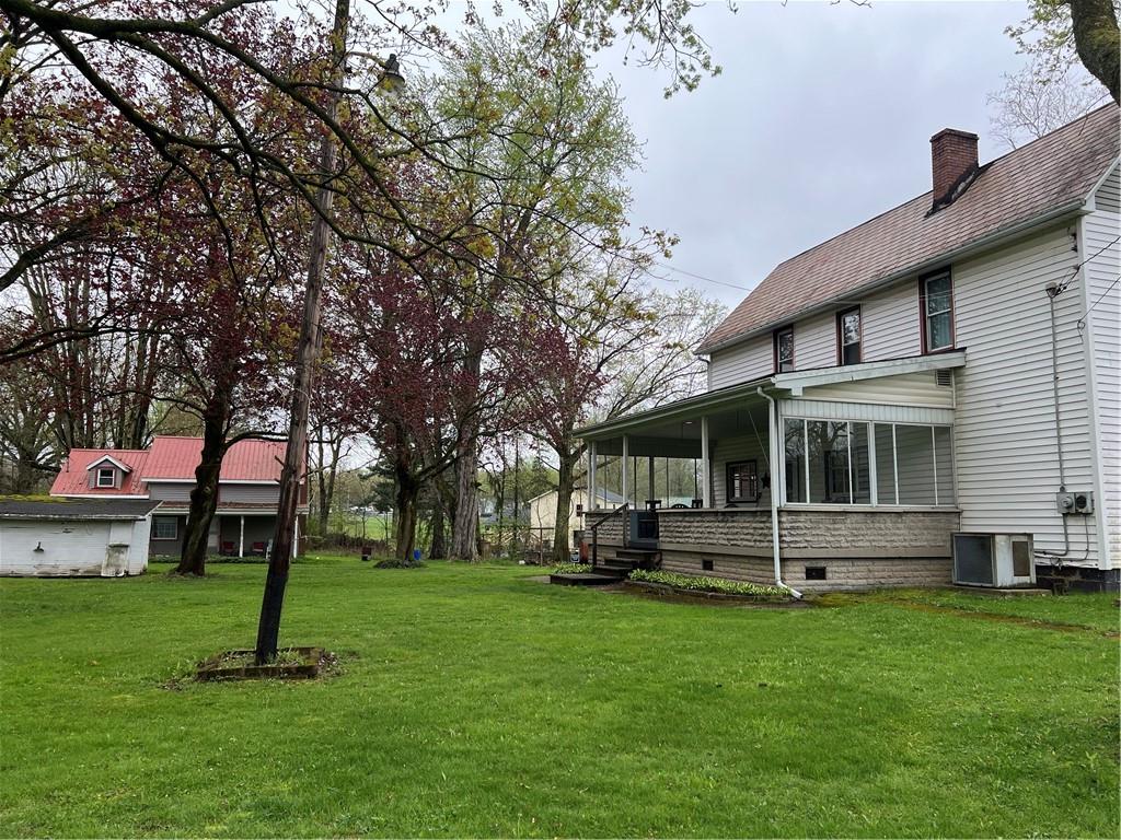 4553 Marr Road Pulaski, PA 16143 - Photo 2 of 5 a front view of house with a garden