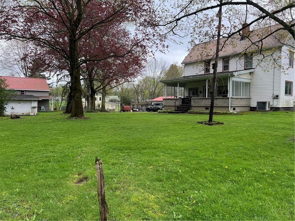 4553 Marr Road Pulaski, PA 16143 - Photo 3 of 5 a view of a building with a big yard