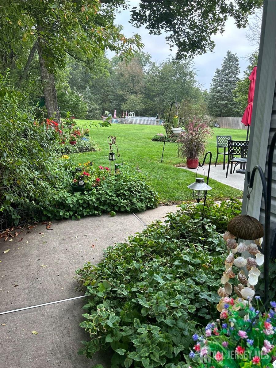 33 Ellison Road Somerset, NJ 08873 - Photo 29 of 38 a view of a garden with a fountain