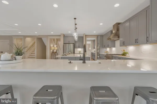 a bathroom with a toilet a sink and a mirror