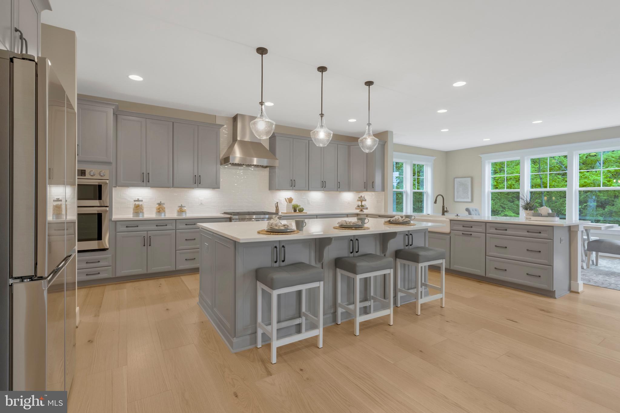 16020 Keymer Hl Court Hamilton, VA 20158 - Photo 23 of 69 a kitchen with stainless steel appliances kitchen island granite countertop a stove a sink and a refrigerator