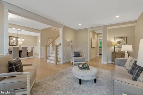 a living room with furniture a window and a fireplace