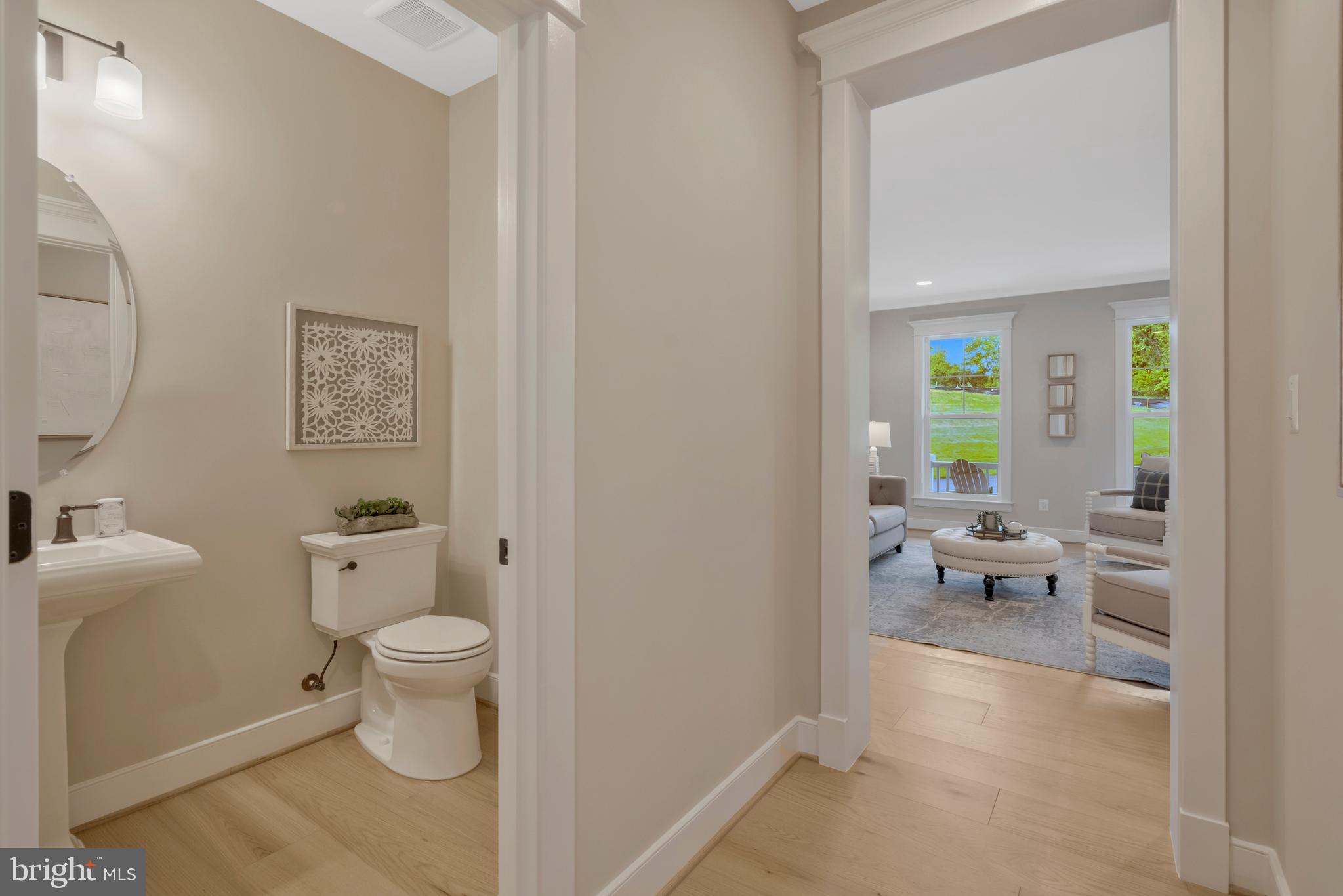 16020 Keymer Hl Court Hamilton, VA 20158 - Photo 30 of 69 a bathroom with a toilet a sink and a mirror