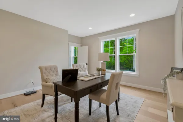 a bedroom with a bed and a night stand