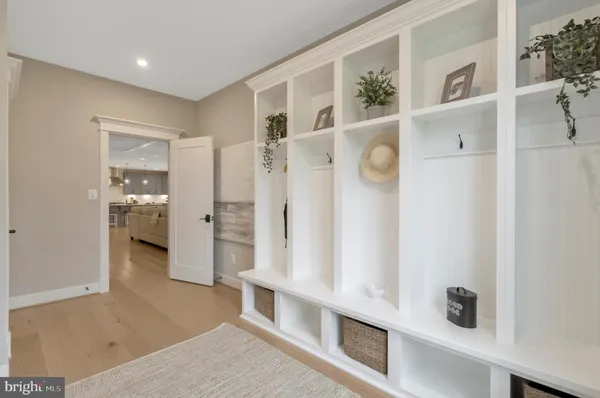 a bathroom with a toilet a sink a mirror a bathtub and shower