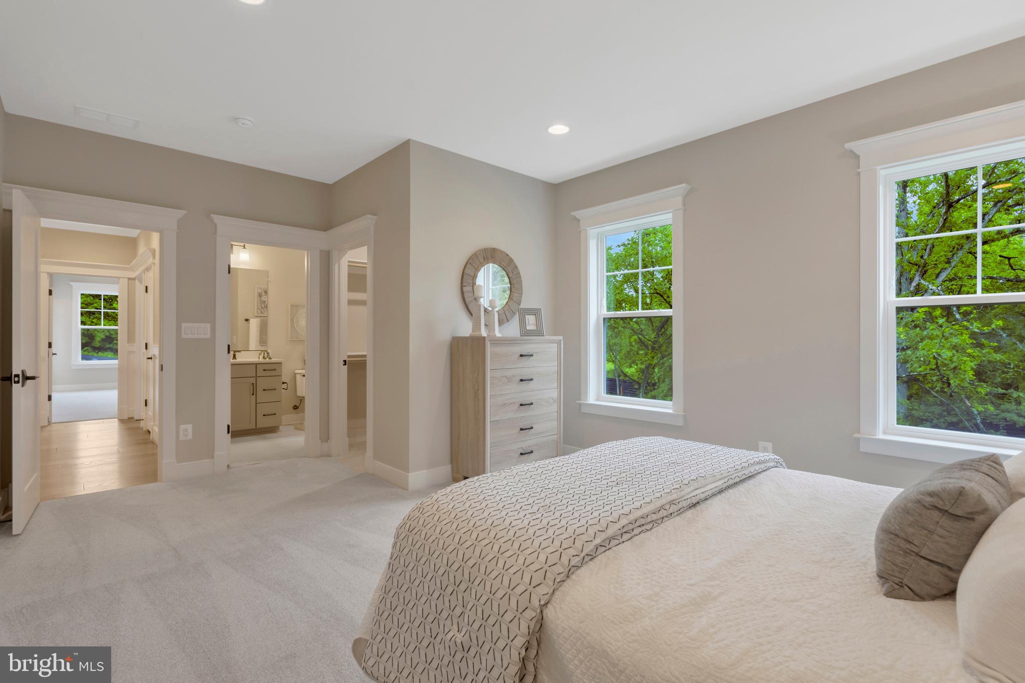 16020 Keymer Hl Court Hamilton, VA 20158 - Photo 58 of 69 a spacious bedroom with a large bed and a chandelier