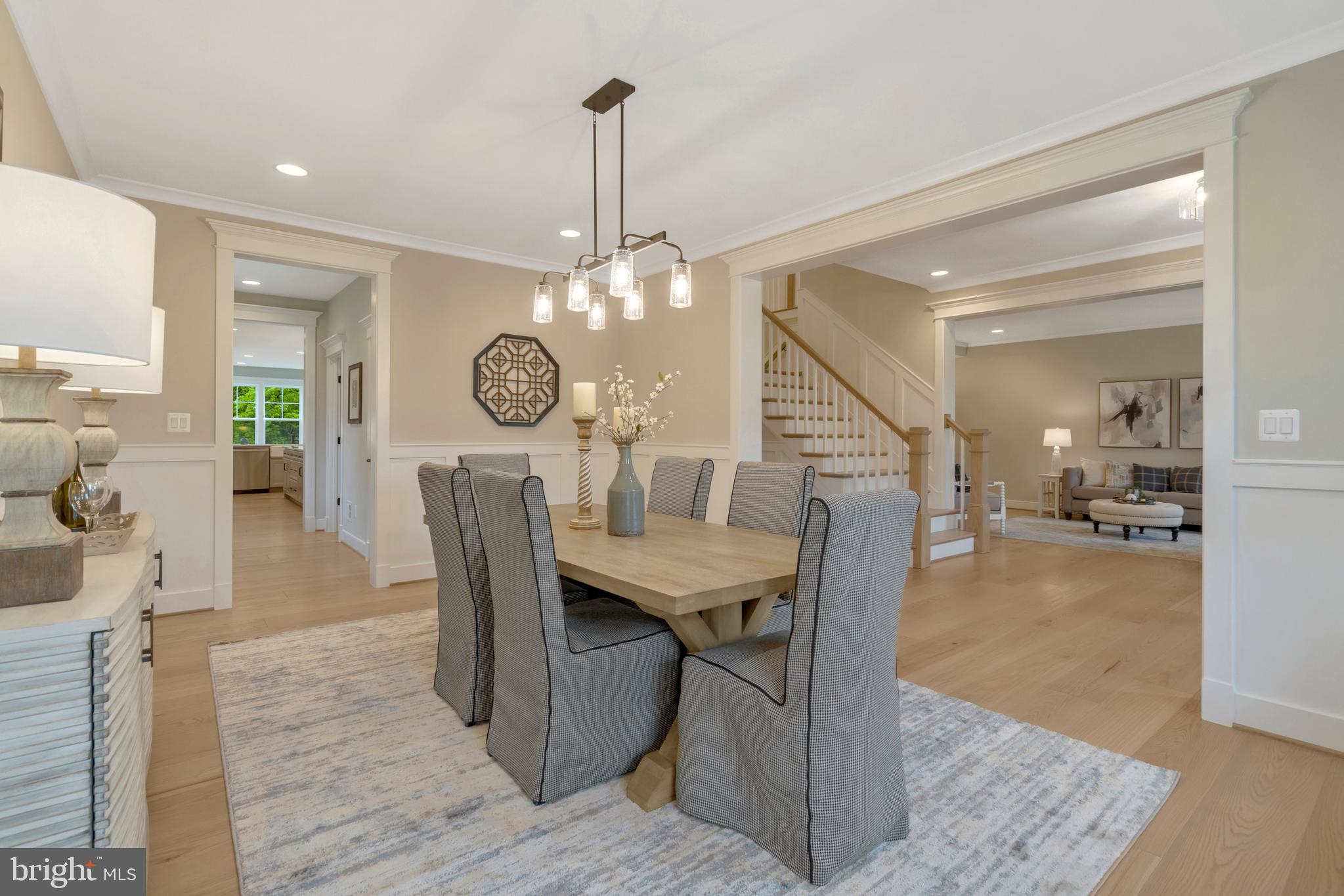 16020 Keymer Hl Court Hamilton, VA 20158 - Photo 9 of 69 a dining room with wooden floor a chandelier a wooden table and chairs