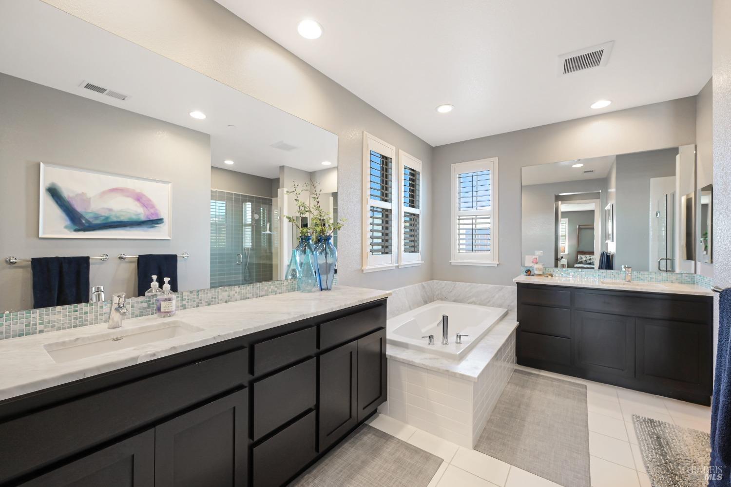 46 Audubon Way Novato, CA 94949 - Photo 19 of 31 a bathroom with a tub double vanity sink and mirror