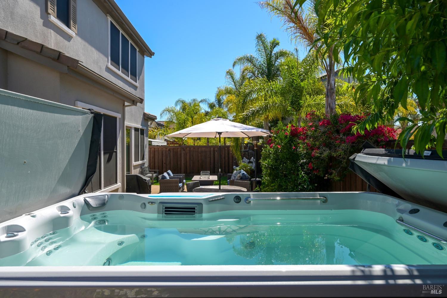 46 Audubon Way Novato, CA 94949 - Photo 29 of 31 a backyard of a house with barbeque oven table and chairs