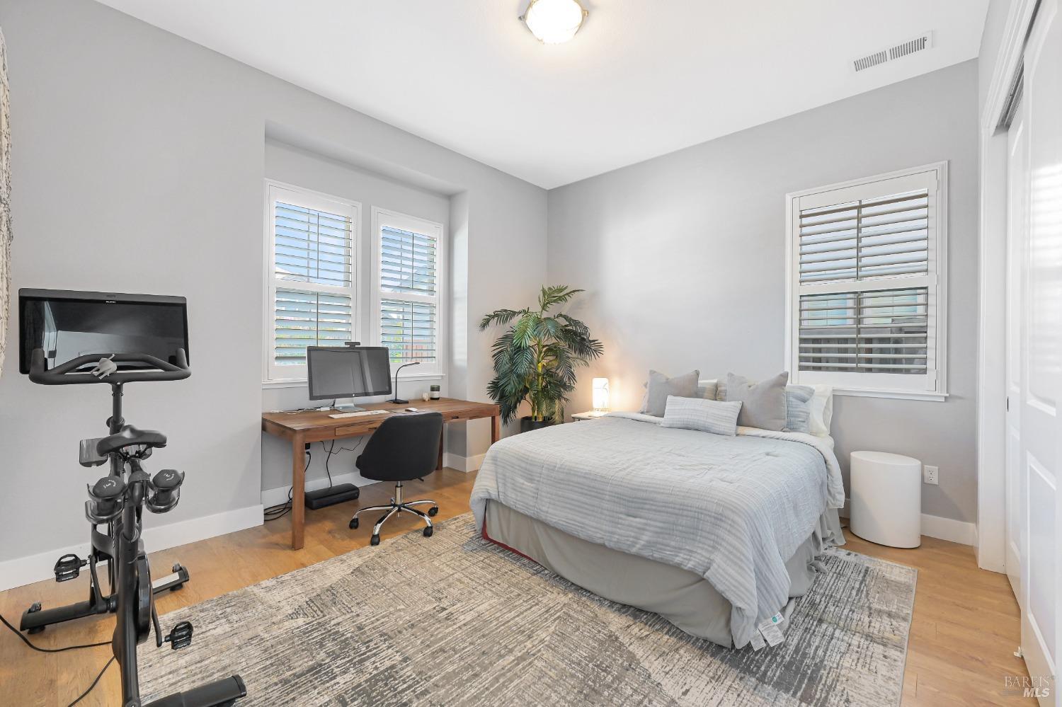 46 Audubon Way Novato, CA 94949 - Photo 7 of 31 a bedroom with a bed table chair and a window