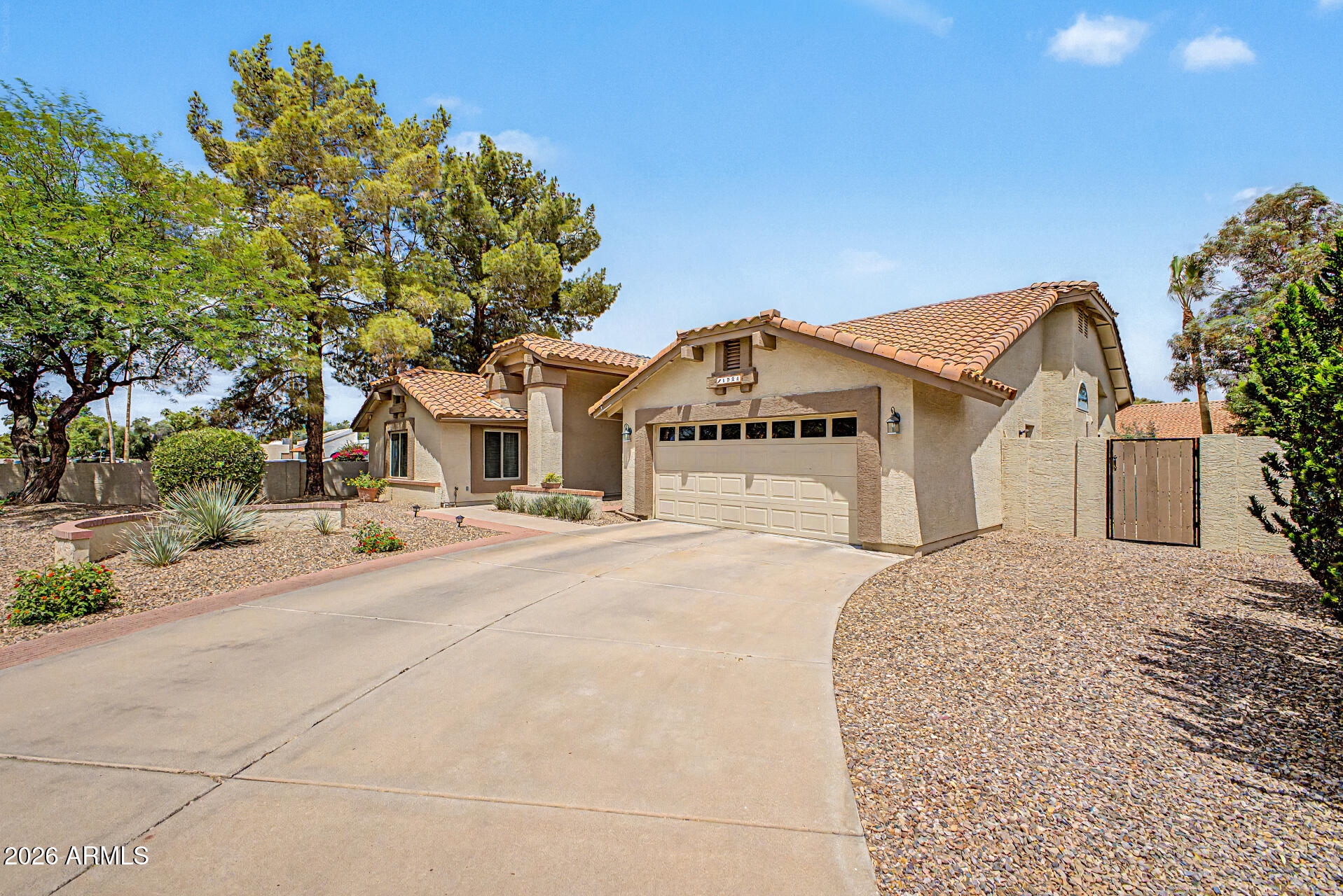 1924 East El Freda Road Tempe, AZ 85284 - Photo 34 of 56 a front view of a house with a yard and garage