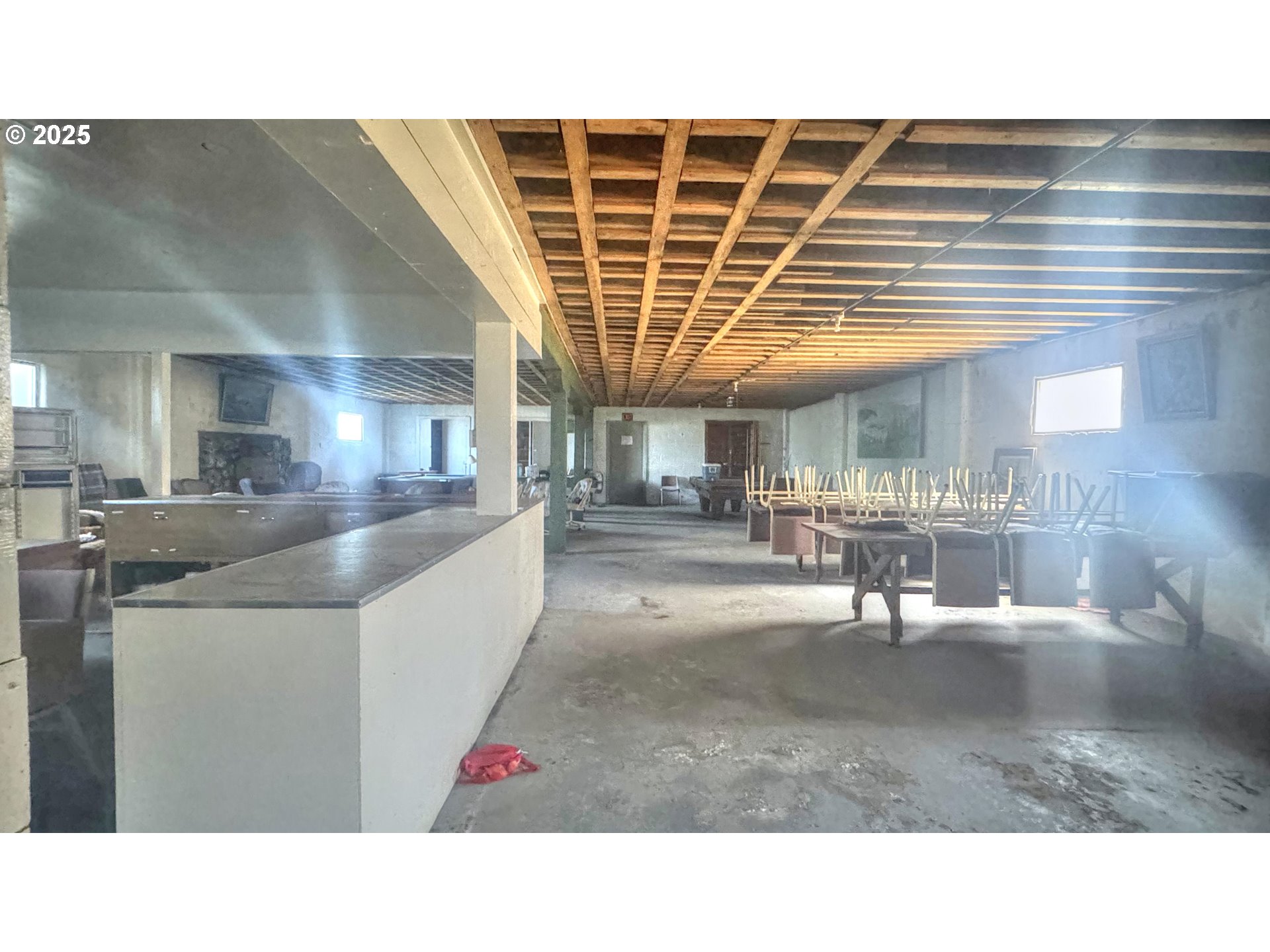 33043 Nesika Road Gold Beach, OR 97444 - Photo 15 of 23 a open kitchen with a sink and a refrigerator