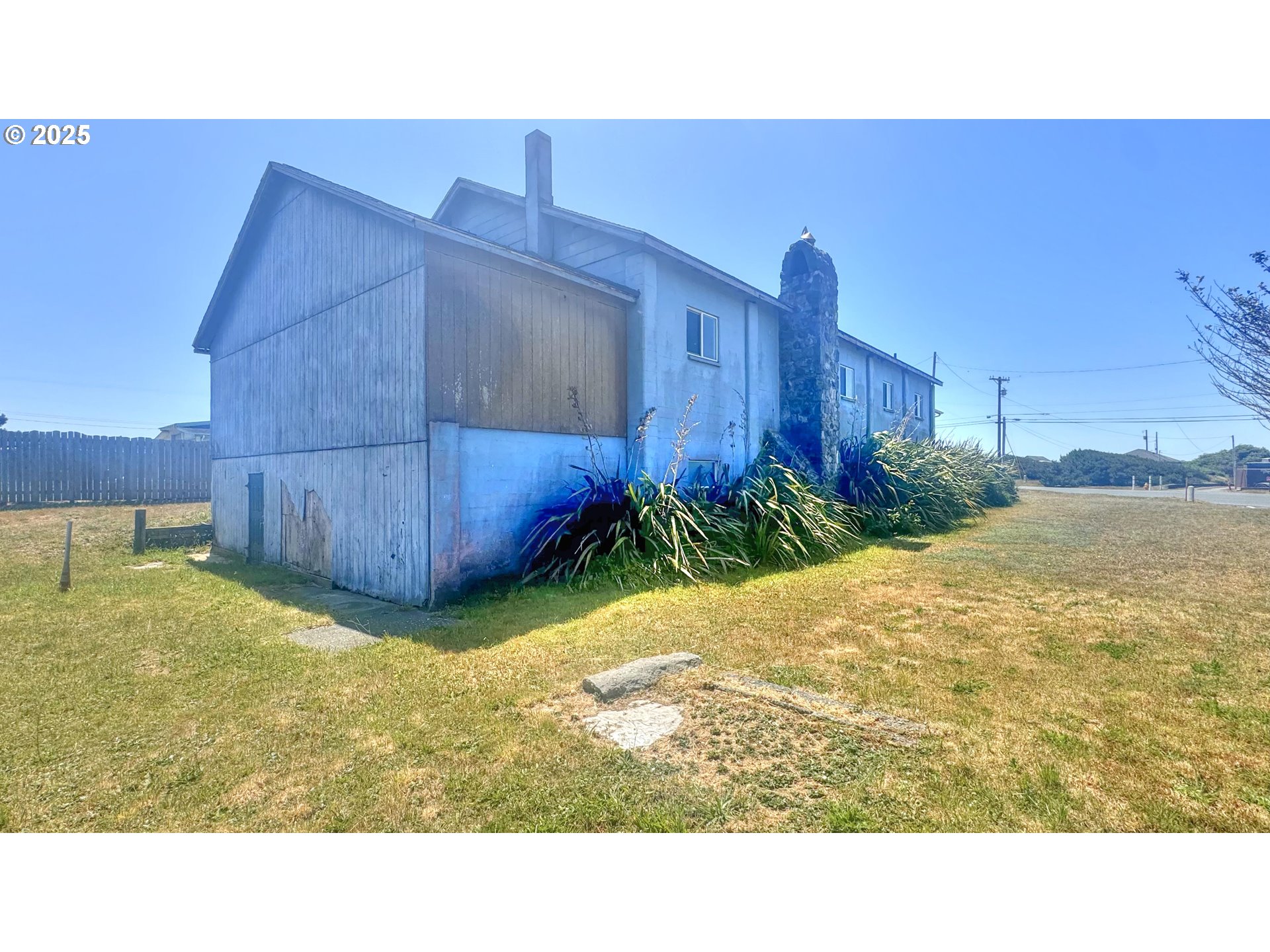 33043 Nesika Road Gold Beach, OR 97444 - Photo 3 of 23 a black and white photo of a house