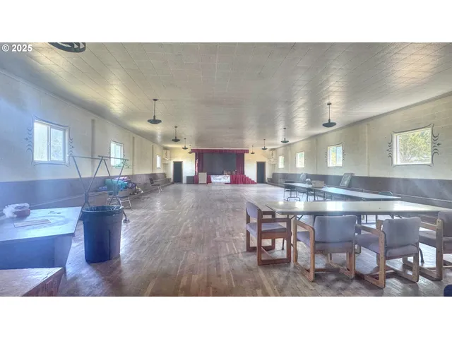 a kitchen with a table and chairs