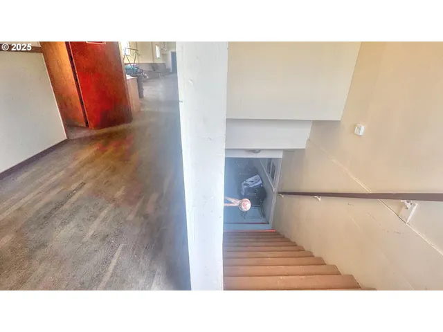 a kitchen with a table and chair