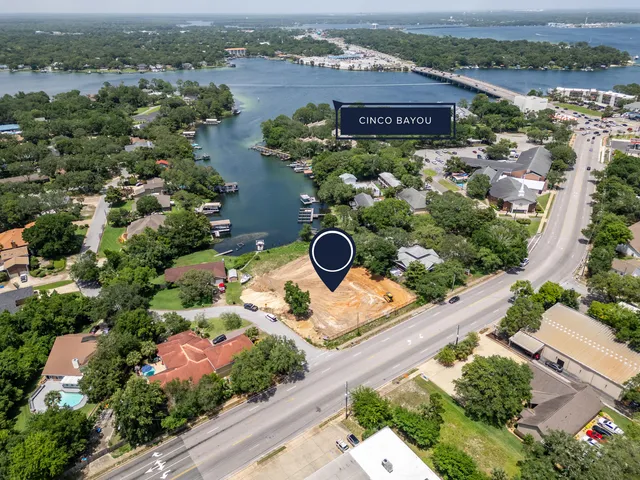 a view of a swimming pool with a chair and tables