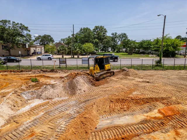 an aerial view of residential house with an outdoor space and seating space