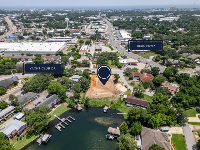 an aerial view of a house with a lake view