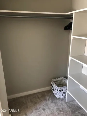 a room with water heater on the shelf