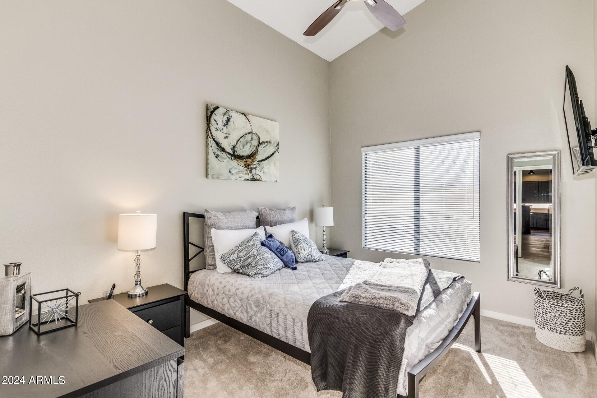 14630 North 44th Street Phoenix, AZ 85032 - Photo 21 of 32 a bedroom with a bed and wooden floor