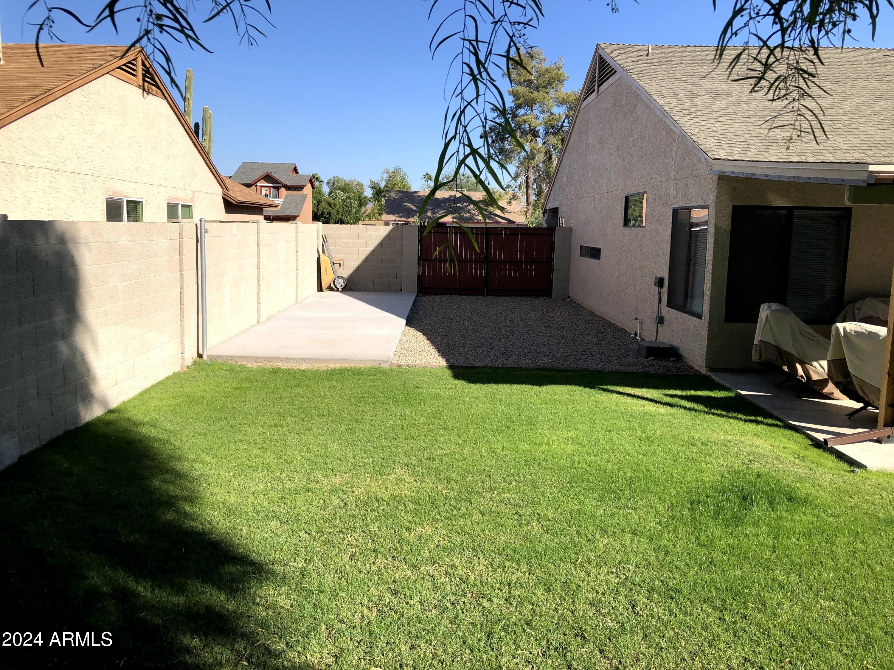 14630 North 44th Street Phoenix, AZ 85032 - Photo 30 of 32 a front view of a house with a yard