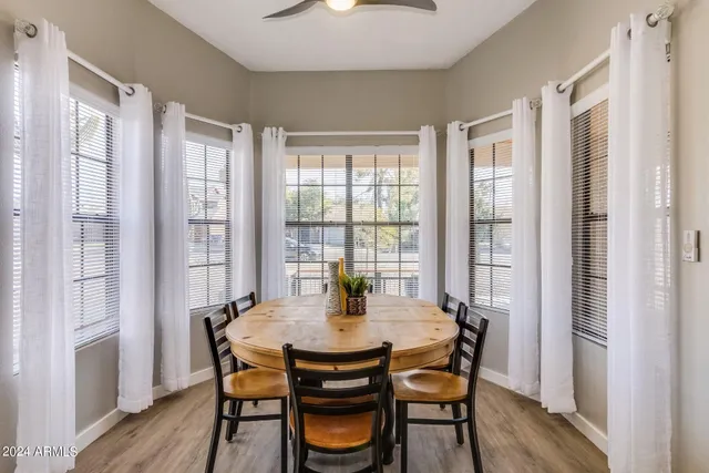a view of a dining room with furniture window and wooden floor