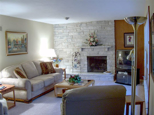 6858 Rydberg Road Rockford, IL 61109 - Photo 3 of 6 a living room with furniture and a fireplace