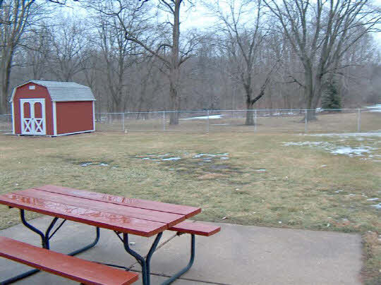 6858 Rydberg Road Rockford, IL 61109 - Photo 6 of 6 a backyard of a house with table and chairs