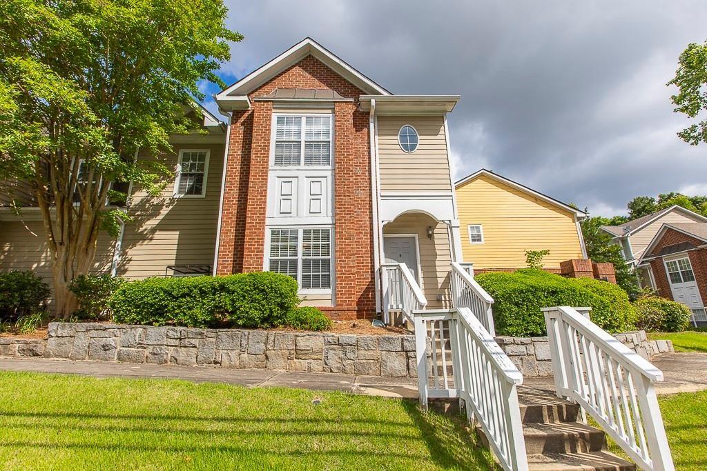 a front view of a house with garden