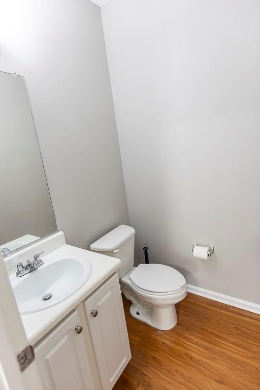 1731 Pryor Road Southwest, Unit 109 Atlanta, GA 30315 - Photo 11 of 34 a white toilet sitting next to a bathroom sink