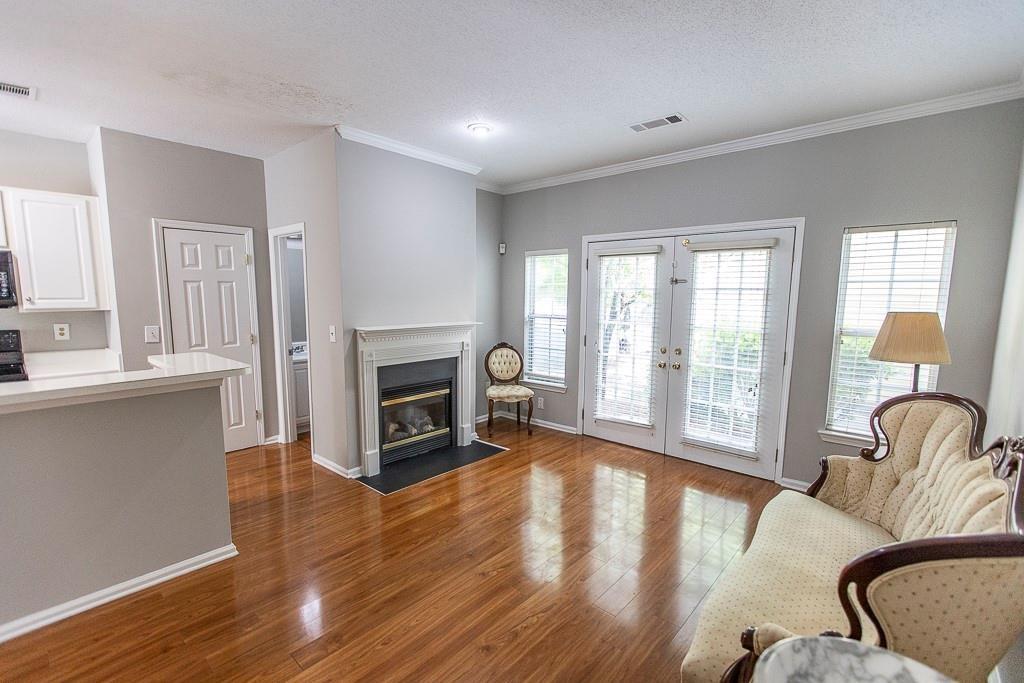 1731 Pryor Road Southwest, Unit 109 Atlanta, GA 30315 - Photo 12 of 34 a living room with furniture and a fireplace